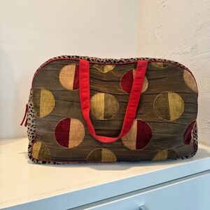 Elegant Women's Travel Bag with Red and Gold Accents